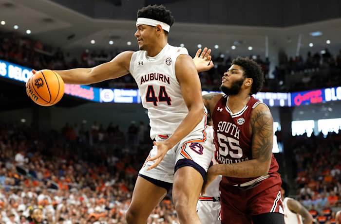 Mar 5, 2022; Auburn, Alabama, USA; Auburn Tigers center Dylan Cardwell (44) grabs a rebound against South Carolina Gamecocks forward Ta'Quan Woodley (55) during the first half at Neville Arena. Mandatory Credit: John Reed-USA TODAY Sports